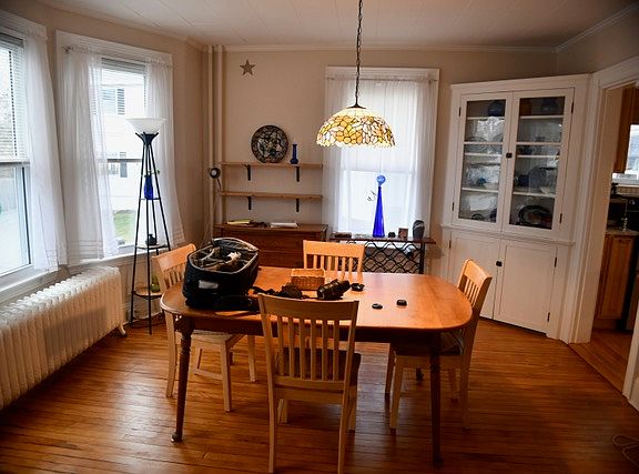 Dining room off the kitchen with lots of sunlight.