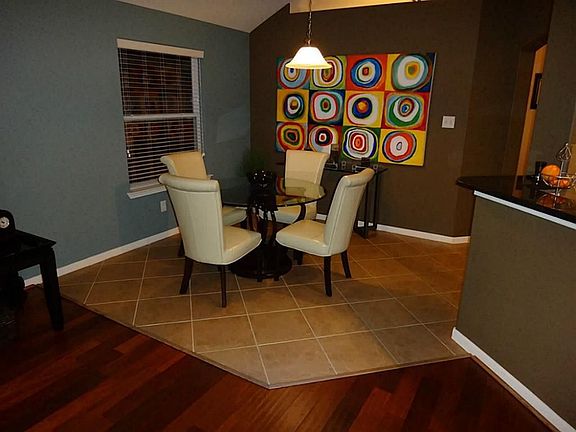 Breakfast area off family room has tiled floors.