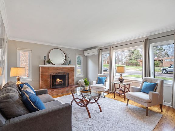 Elegant and bright inviting living room with large windows.