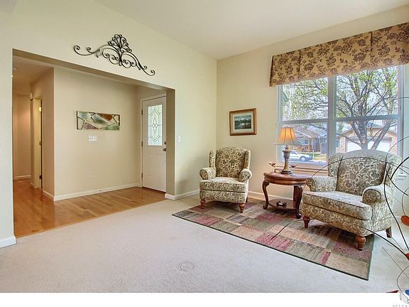 Large formal living room with high ceilings and attached to the formal dining room. Wood flooring fr