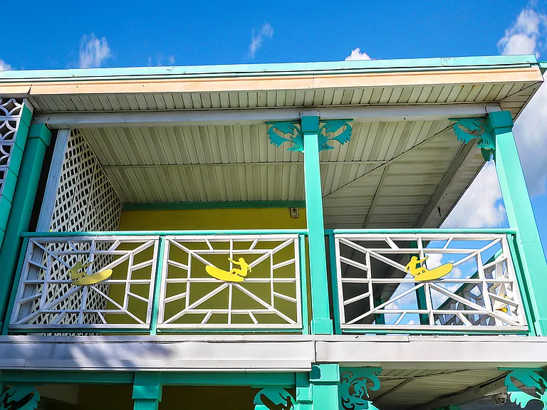 The surfers and corbels at top of the columns were all handmade by us