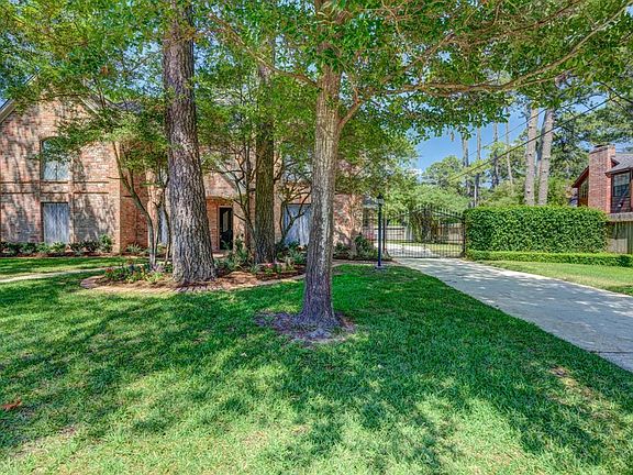 Gated, large driveway with a hedge of Jasmin to sweeten your welcome home!