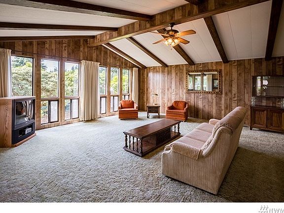 The main living area is quite large and has tons of windows, a vaulted ceiling.