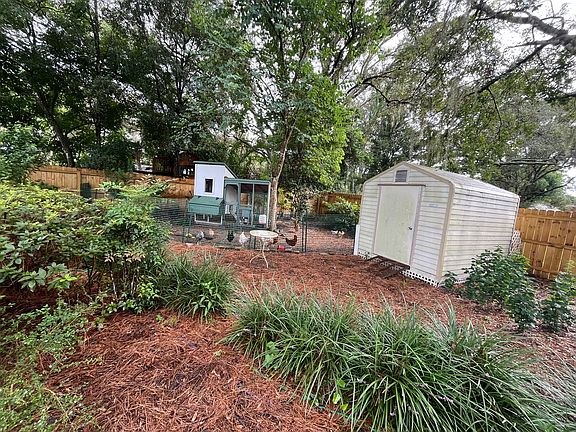 large backyard includes shed and chicken coop