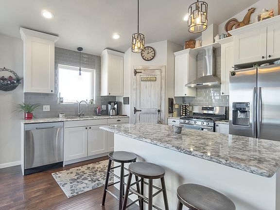 Kitchen with stainless steel appliances, gas stove