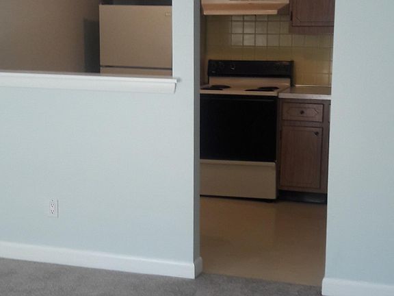 Kitchen opens onto living room.