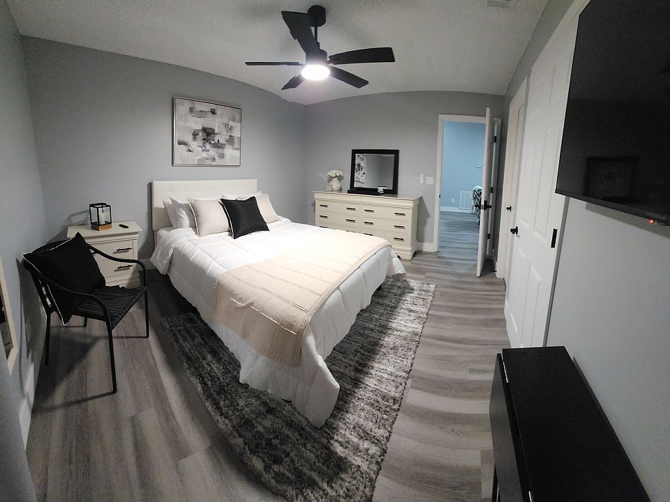 Fully renovated bedroom with new furniture and a private bathroom.