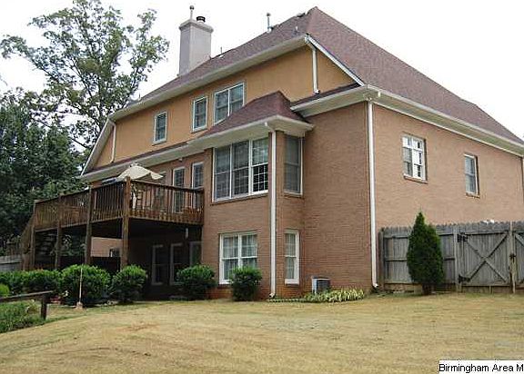 REAR BACK LEFT CORNER SHOWING A PORTION OF THE SPACIOUS BACKYARD