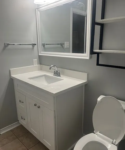 New cabinets, mirrors, light fixtures, toilets