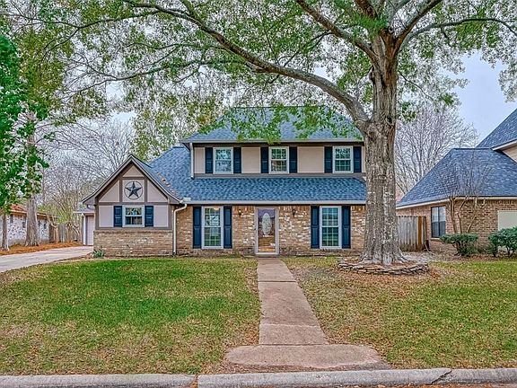 Traditional home with great curb and large mature trees throughout the front and backyard.