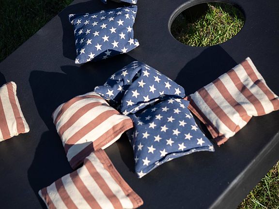 Stars, stripes, and friendly competitioncornhole brings the fun to the lawn at The Summer Kickoff Party