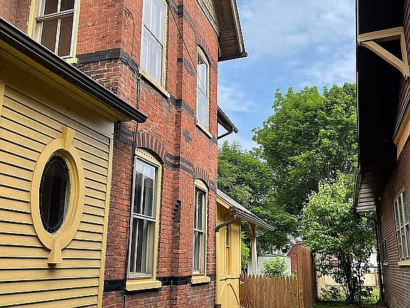 Side with Victorian window.