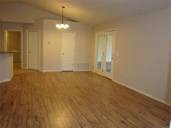 From living room towards dining area, kitchen and Master suite. Beautiful new flooring in this great room area.