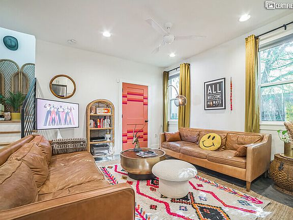 Living room with 2 full size leather sofas, 1/2 bathroom