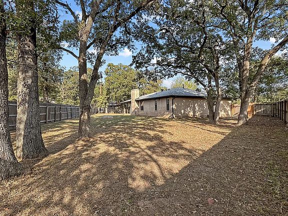 Another view of the large fenced in back yard.