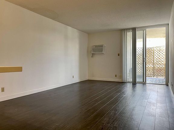 Spacious living room with premium hard wood flooring