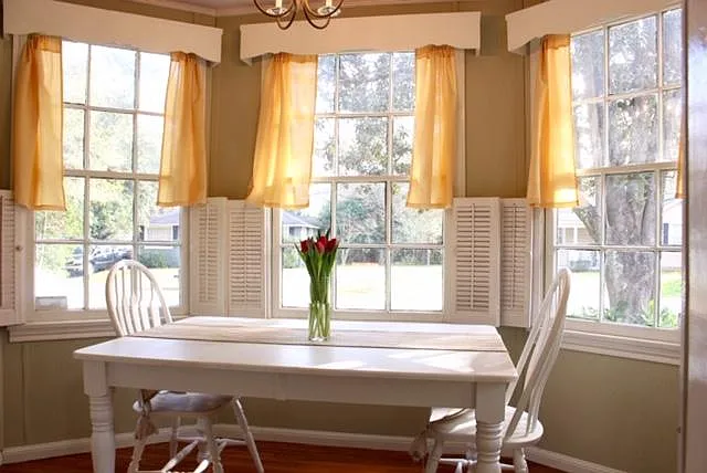 Breakfast room with bay window that allows morning sun.