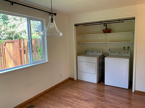 Washer/dryer included with luxury curtain rods