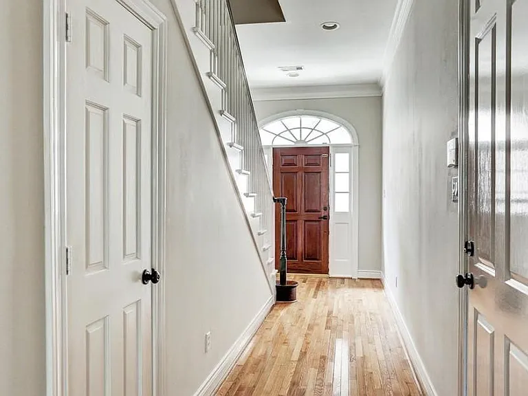 as you enter, you will be greeted with original hard wood floors