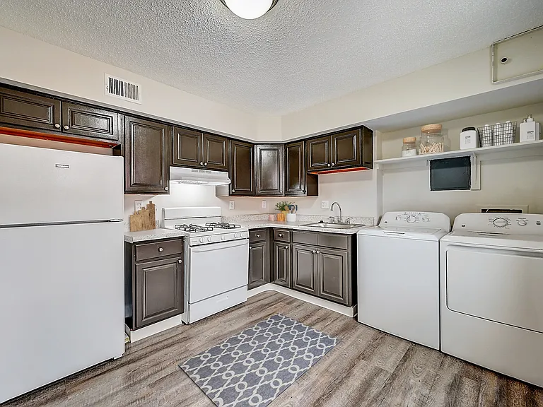 3 BR 1 BA Recently Renovated Townhouse Style Apartments featuring New gray carpet, Neutral paint scheme, Premium hardwood-style flooring, Neutral paint scheme, Upgraded light fixtures, New cabinets, Matching stainless steel appliances, Washer/Dryer, Air c
