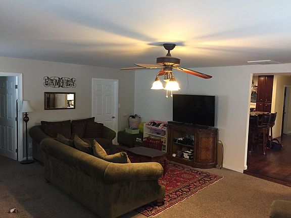 Large Family room with laundry room door at back of picture