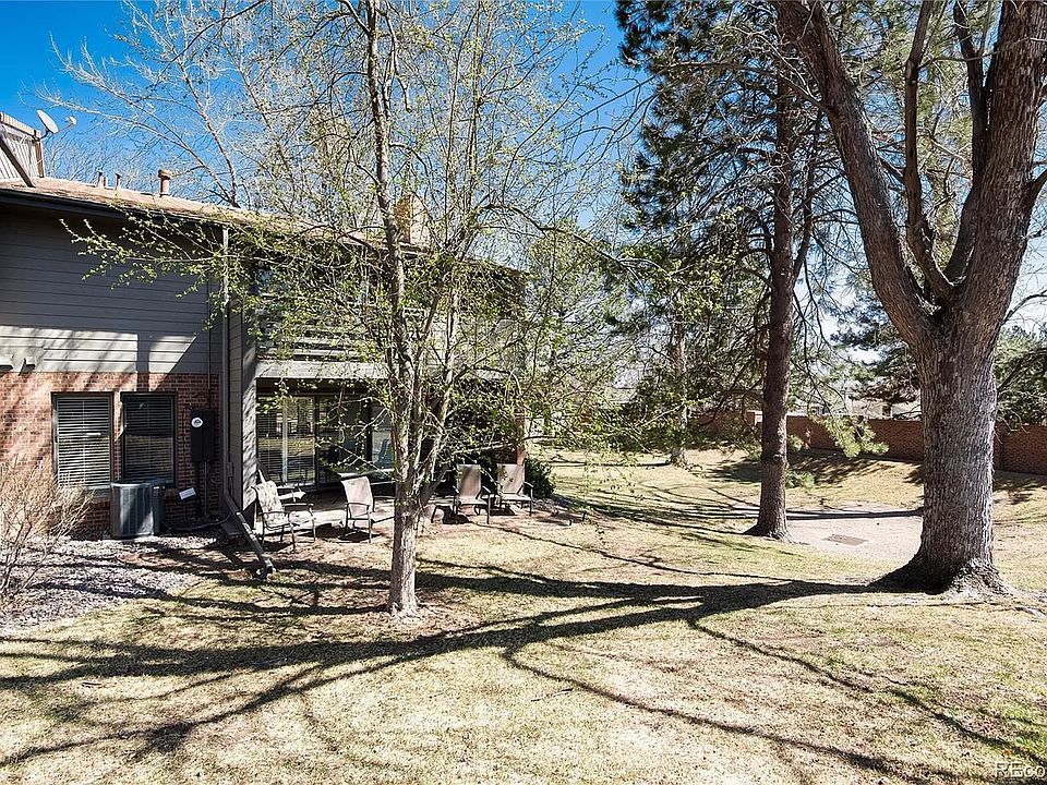 From the back side of the townhouse- patio with outdoor furniture