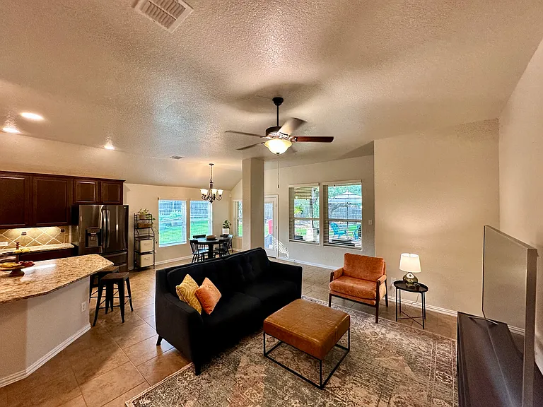 Open-concept kitchen, family room, breakfast nook with backyard access