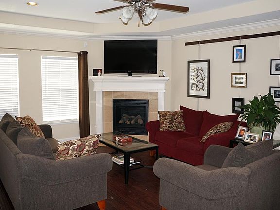 Open and bright family area downstairs with remote control gas firepace.