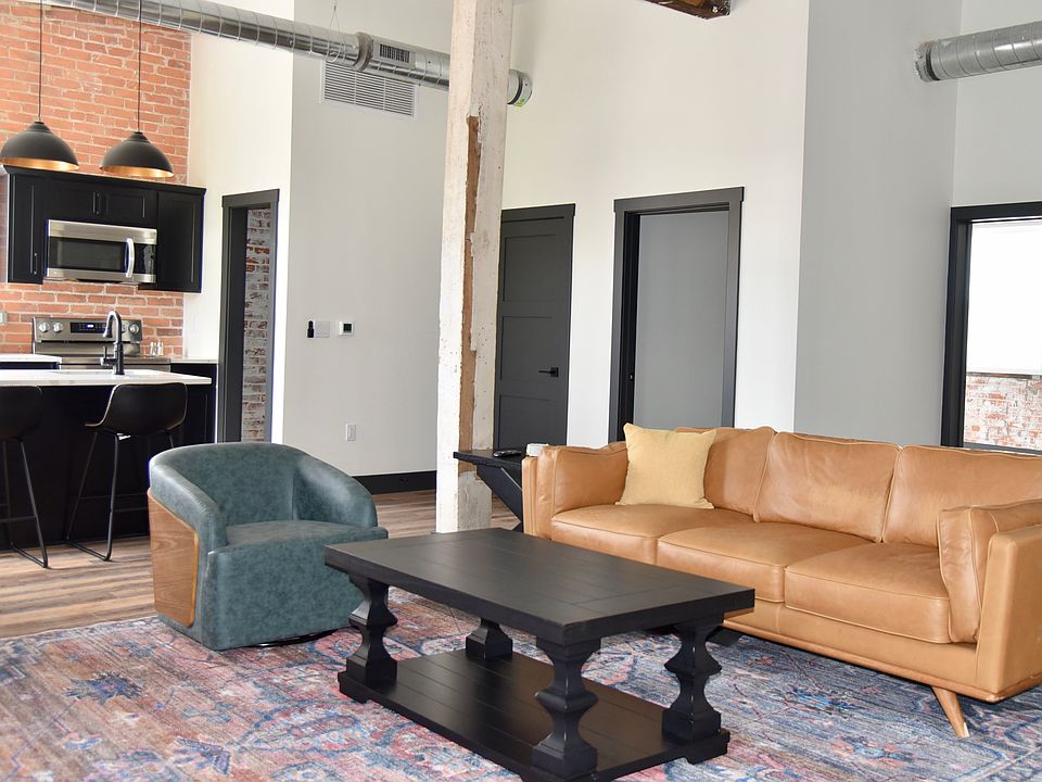 Truly open concept living. Enter through your private entrance into your living room with a large leather sofa, a grand kitchen with everything you will need, a dining table for 6 and a reading area.