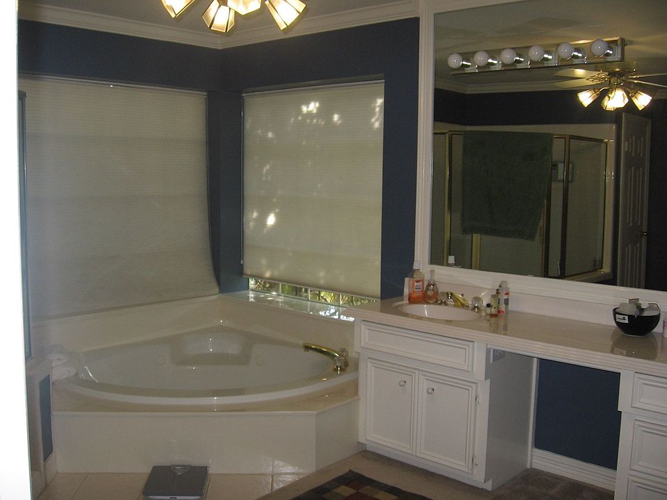 Master bath w/updated paint, whirlpool tub.  Updating fixtures to satin nickel