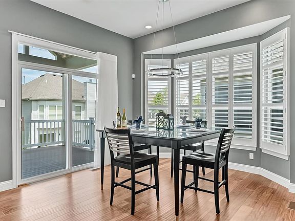 Bay Window at Nook, Slider with transom at the Covered Deck with ceiling fan. Plenty of natural light and space