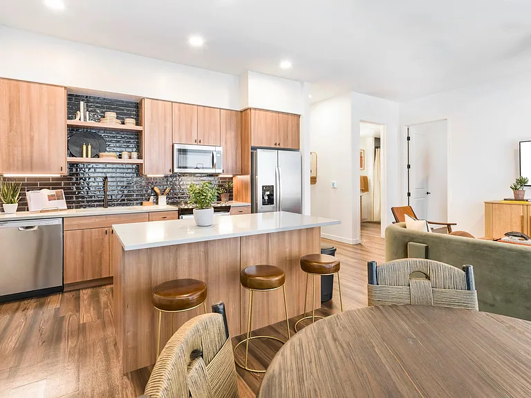 Thoughtful design meets everyday comfort in these airy, open kitchens at Modera Higley Commons.