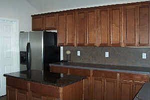 Kitchen with Granite Island Countertop