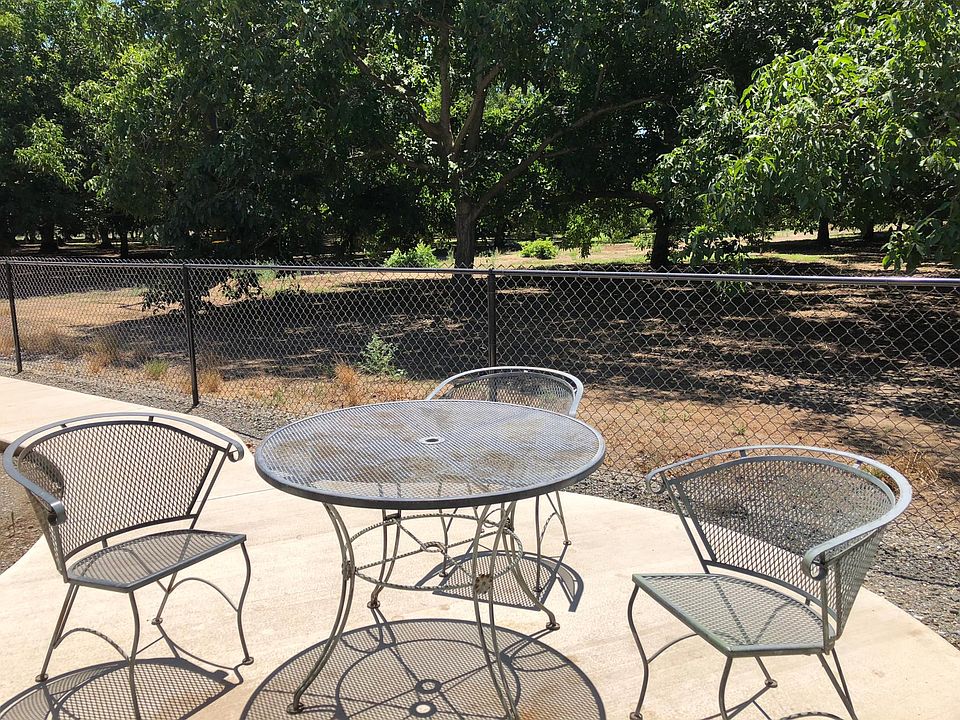 Additional outside sitting area, adjacent to mature walnut orchard.