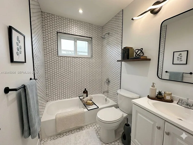 7720 Raleigh St — Photo 13
