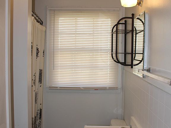 bathroom with shower and vanity