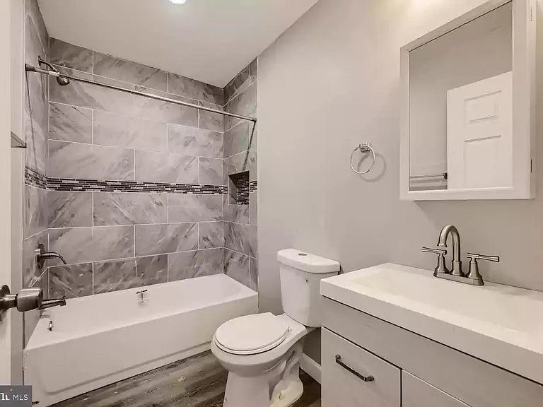 Full Bathroom (empty view prior to most recent tenant moving in)
