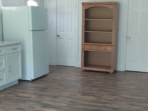 Kitchen, living room area 1/2 bath closet .