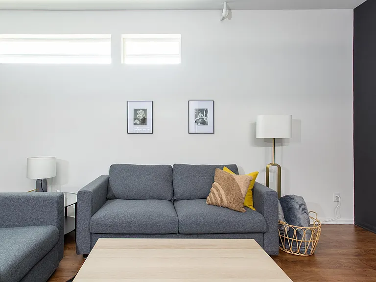 High Windows provide great indirect lighting and privacy.... Big wall space for art or hanging TV...
