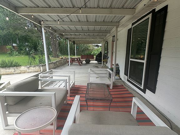 Covered front patio to enjoy nature