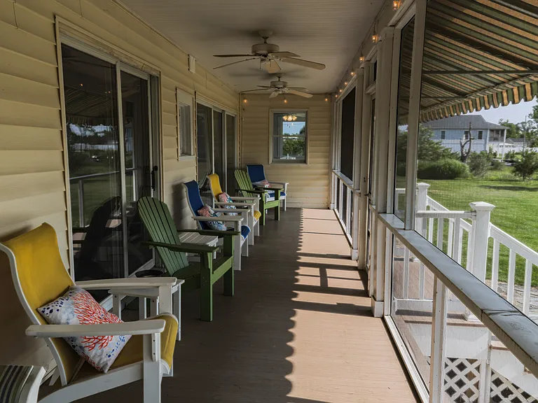 Great screened in porch with lovely view of water