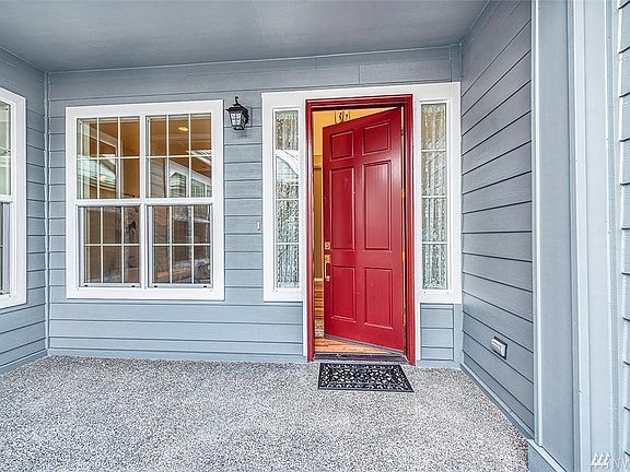 The distinctive courtyard entry has covered and uncovered spaces and a garden area. 
