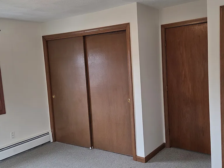 Primary bedroom includes a double closet and another additional closet.