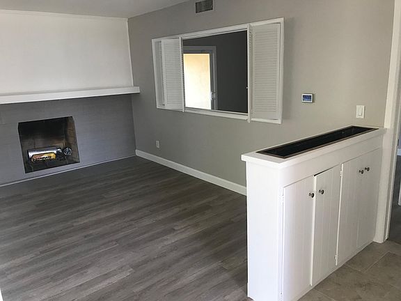 Living Room with window looking into bonus room