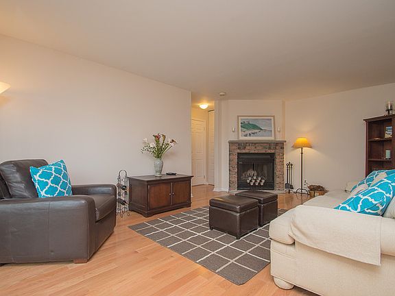 Large Living Room
						:
						Features a wood burning fireplace and sliding glass doors to patio.