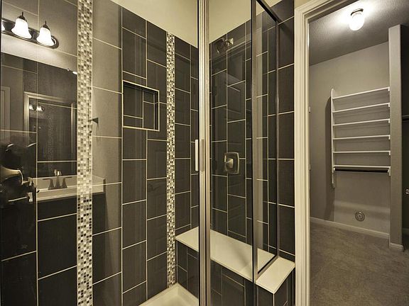 M. bedroom with bath and walk-in closet on main level. Additional 1/2 bath/powder room and full bath on second level. No tub in owners suite bath.