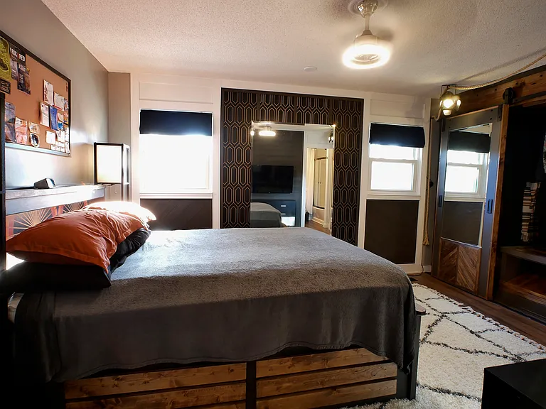 Main bedroom. Includes mirror, large custom closet, and attached private custom bath suite. Inquire about fully furnished option.