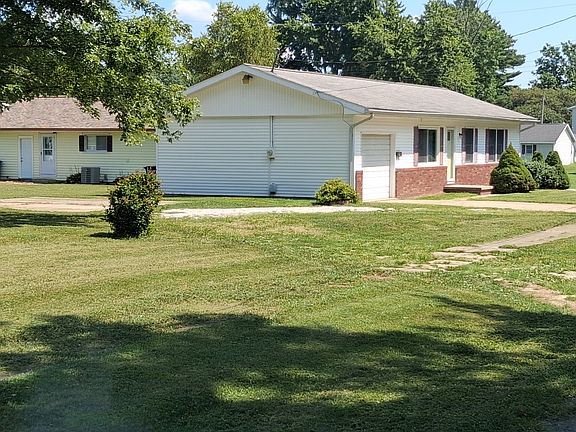 Nice open side yard, with concrete patio or additional offstreet parking.
