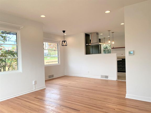 Dining area is large enough for a 6-8 person table.