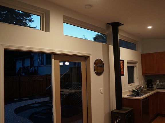 French door out to backyard. High transom windows lets in lots of light.